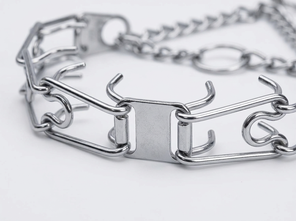 Close up of chrome plated steel construction on prong dog training collar
