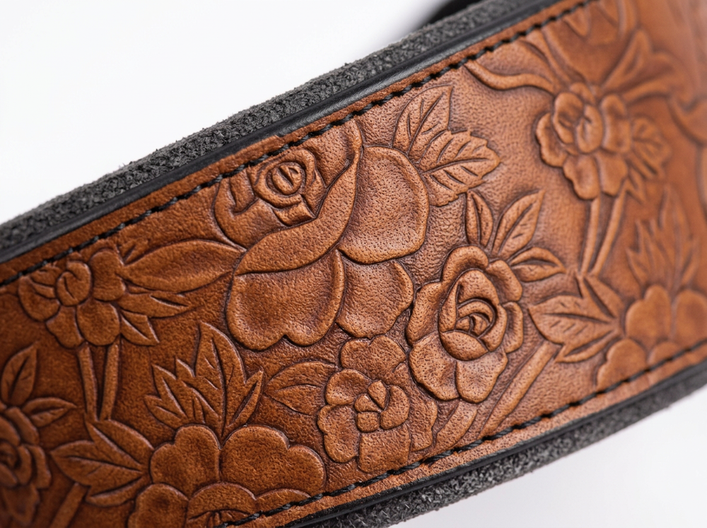 Detailed floral embossed pattern on a brown leather dog collar