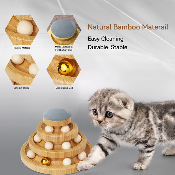 Cat chasing a rolling ball in an interactive wooden toy