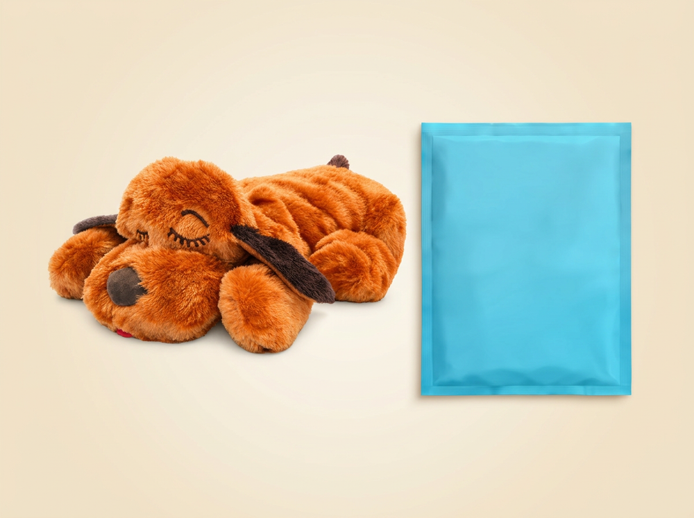 Brown heartbeat puppy plush toy displayed with its included heat pack on a neutral background